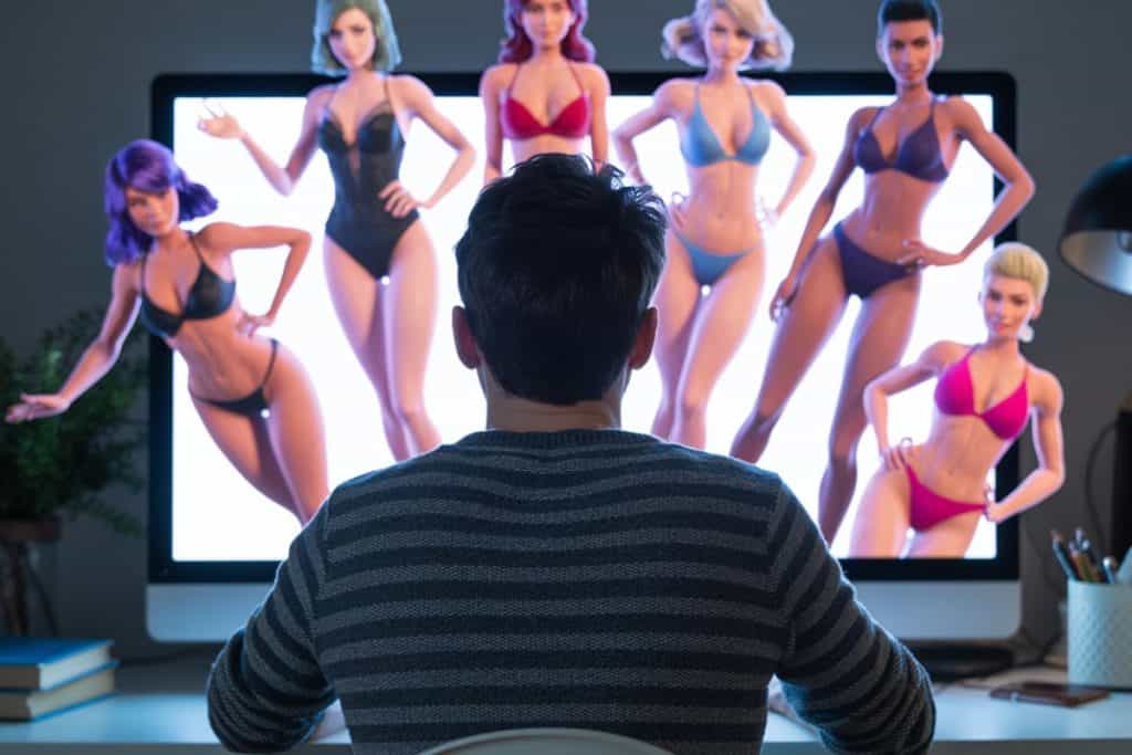 Man stirrar på skärm, datorgrafik av lättklädda kvinnor kommer ut från skärmen